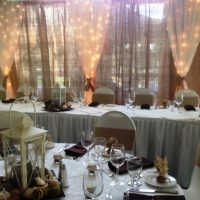 Burlap, twinkle lights by designer weddings