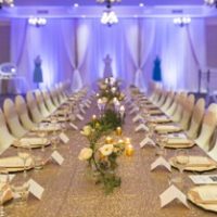 ivory fabric backdrop with gold sequin by Designer Weddings in Victoria BC