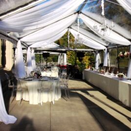 Tent leg draping - clear tent - by Designer Weddings
