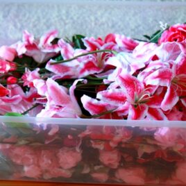 bin of silk flowers by Designer Weddings