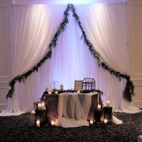 greenery backdrop with fabric panels